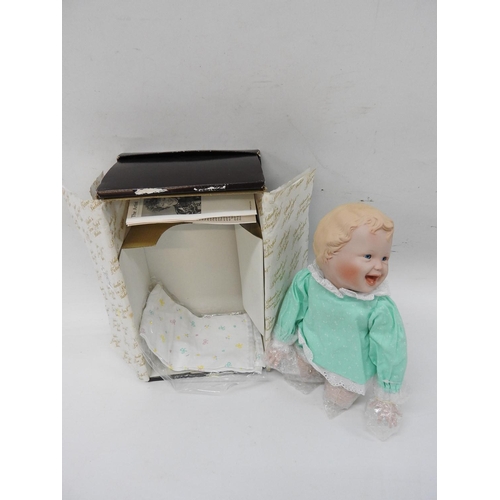 604 - Collector's porcelain doll in box