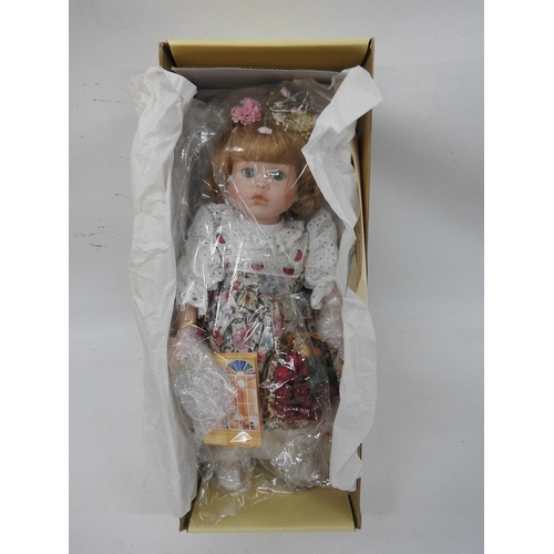 648 - Boxed porcelain collector's doll