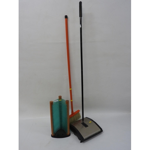 658 - CD rack and a carpet sweeper