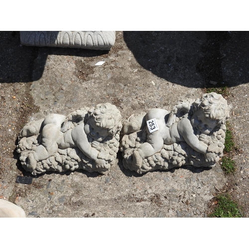 253 - Pair of concrete garden Cherub ornaments