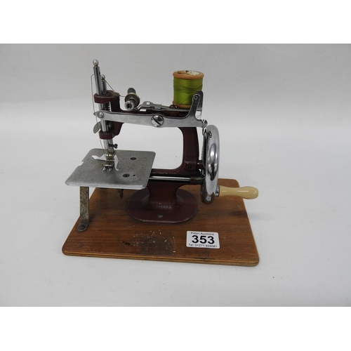 353 - British made grain chain stitch toy hand operated sewing machine - circa 1950