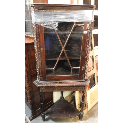 58 - Oak glazed corner cupboard on stand