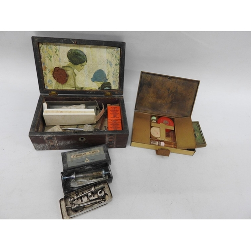 687 - Wooden box and contents, syringes and an old make up tin