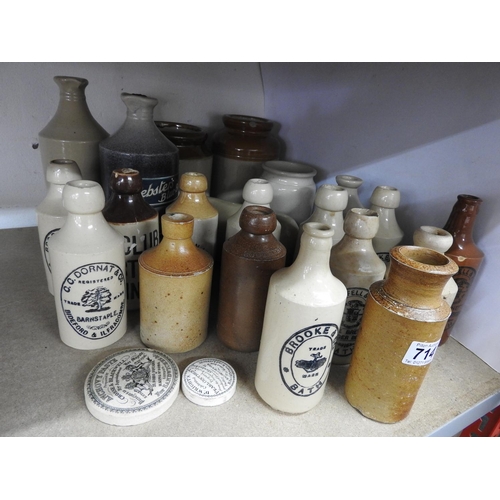 714 - Quantity of stoneware bottles and pot lids