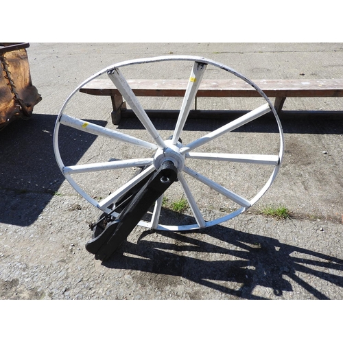 8 - Old metal drive wheel on stand