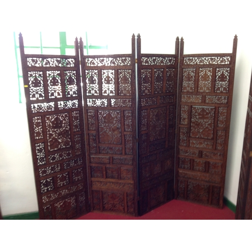 610 - Profusely carved four panel screen to match the previous lot