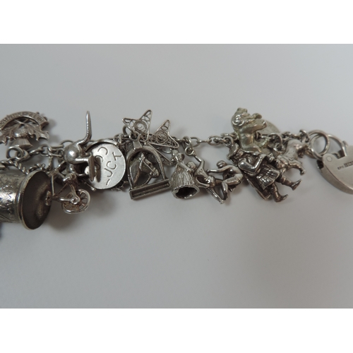 65 - Hallmarked Silver Charm Bracelet