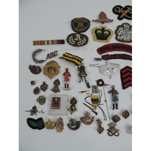 150 - Quantity of Metal and Cloth Military Badges