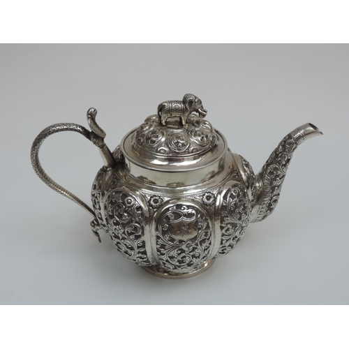 26 - A Three Piece Indian Silver Bachelors Tea Set with Lobed and Profusely Decorated Bodies, Cobra Handl... 