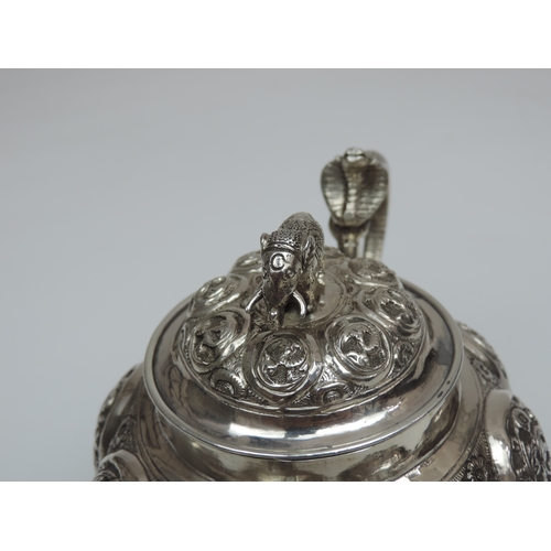 26 - A Three Piece Indian Silver Bachelors Tea Set with Lobed and Profusely Decorated Bodies, Cobra Handl... 