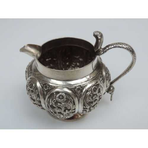 26 - A Three Piece Indian Silver Bachelors Tea Set with Lobed and Profusely Decorated Bodies, Cobra Handl... 