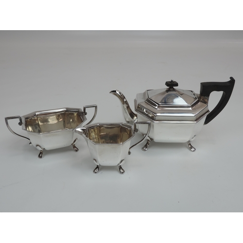 268 - An Art Deco Silver Tea Set - Teapot, Milk & Sugar Canted Rectangular Form Standing on Four Lions Paw... 