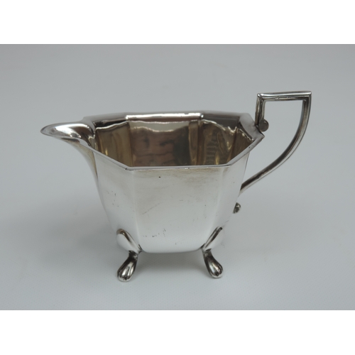 268 - An Art Deco Silver Tea Set - Teapot, Milk & Sugar Canted Rectangular Form Standing on Four Lions Paw... 