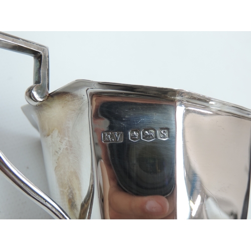 268 - An Art Deco Silver Tea Set - Teapot, Milk & Sugar Canted Rectangular Form Standing on Four Lions Paw... 