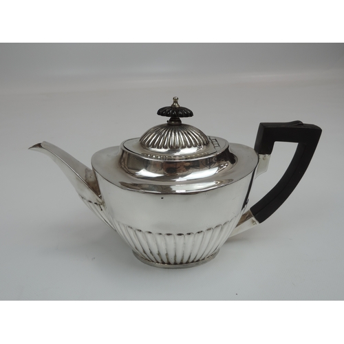 254 - An Edwardian Silver Tea Set - Teapot, Cream/Milk and Sugar with Part-Fluted Decoration, Scroll Handl... 