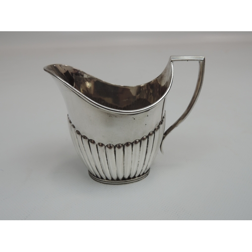 254 - An Edwardian Silver Tea Set - Teapot, Cream/Milk and Sugar with Part-Fluted Decoration, Scroll Handl... 