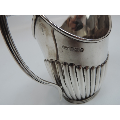 254 - An Edwardian Silver Tea Set - Teapot, Cream/Milk and Sugar with Part-Fluted Decoration, Scroll Handl... 