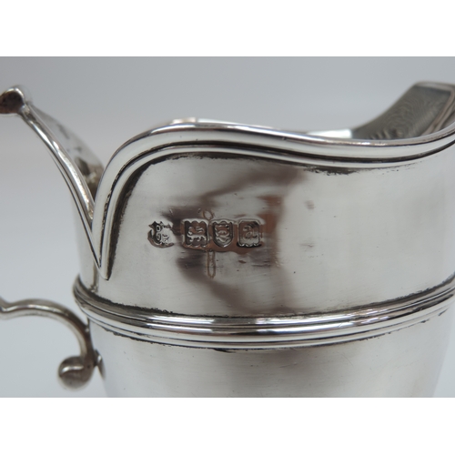 14 - A Late Victorian Silver Milk/Cream Jug with a Central Girdle, Raised Petal Rim, C-scroll Handle and ... 