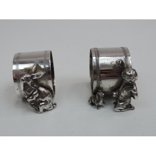 263 - A Pair of Late Victorian Silver Plate Figural Napkin Rings, One with a Young Boy and His Dog, the Ot... 