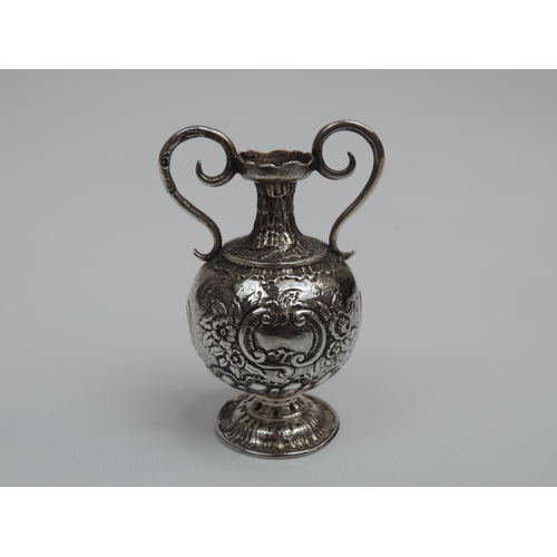 222 - A Miniature Silver Vase in the Classical Twin Handled Urn Style and Embossed with Ffoliage - It has ... 