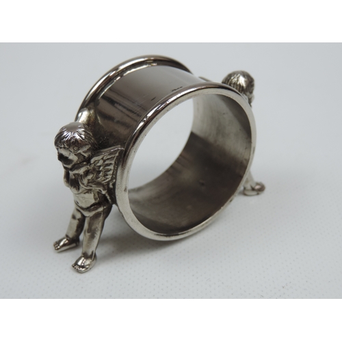 207 - A Late Victorian Silver Plate Figural Napkin Ring of Two Winged Cherubs - Diameter is Approx 1.75