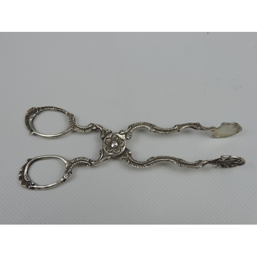 61 - A Pair of  Silver Sugar Nips - Scissor Style with Petal Decoration to the Pivot  -Approx 4.75