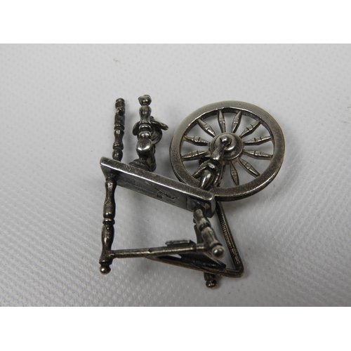 297 - Silver Miniature: A Dutch Silver Miniature Sewing Machine - Hallmarked with the Dutch Sword Mark and... 