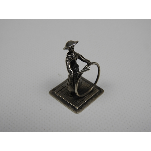 317 - Silver Miniature: A Dutch Silver Miniature of a Girl Playing with a Hoop and Stick - Hallmarked with... 