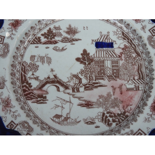 72 - An Antique Willow Pattern Plate - Decorated in Brown, Red and Blue - 10.5”/26cm in diameter