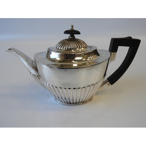 21 - An Edwardian Silver Tea Set - Teapot, Cream/Milk and Sugar with Part-fluted Decoration, Scroll Handl... 