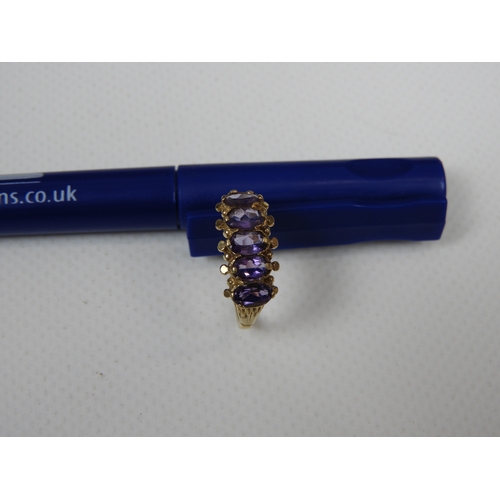 284 - 9ct Yellow Gold Amethyst Five Stone Ring