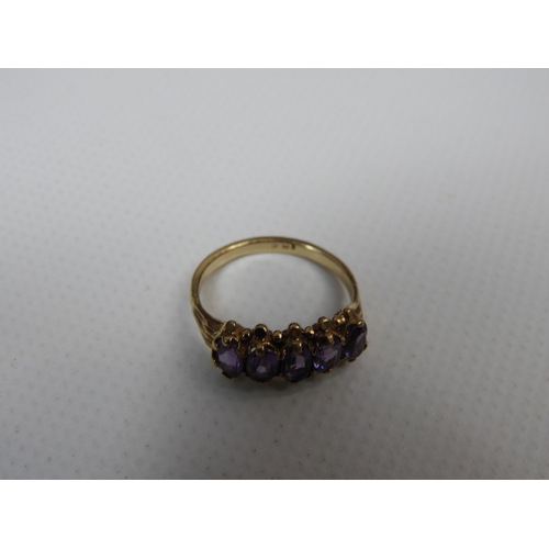 284 - 9ct Yellow Gold Amethyst Five Stone Ring