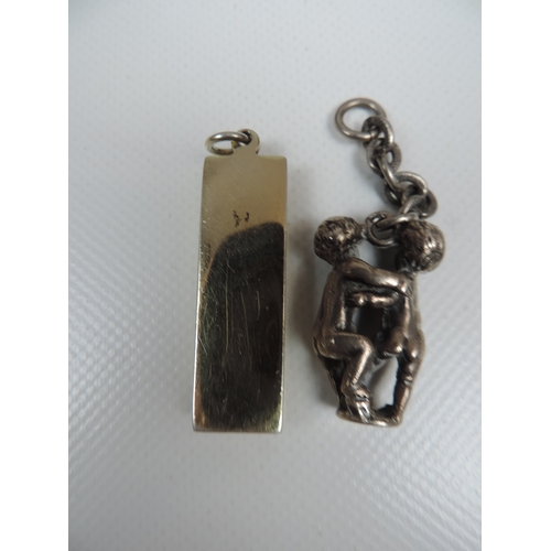 29 - Silver Gilt Ingot and Cherub Charm