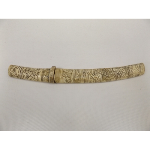 31 - Carved Bone Cased Dagger