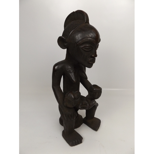 564 - 2x Carved African Figures - Largest 24