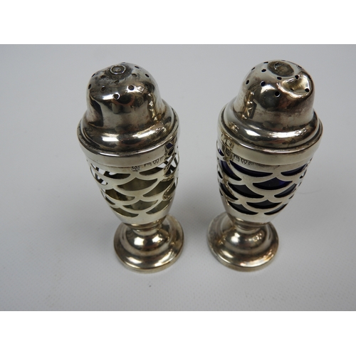 217 - Pair of Chester Silver Pepper Pots one with Original Glass Liner