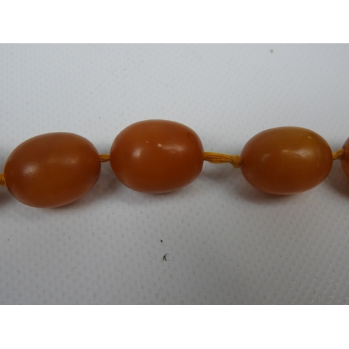 66 - Necklace - String of Amber Coloured Beads