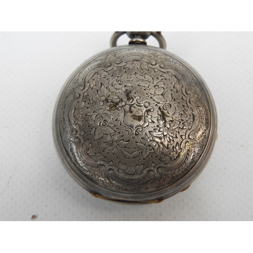 388 - Silver Cased Ornately Faced Fob Watch