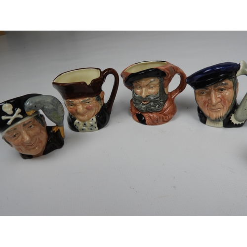 604 - Collection of Miniature Character Jugs