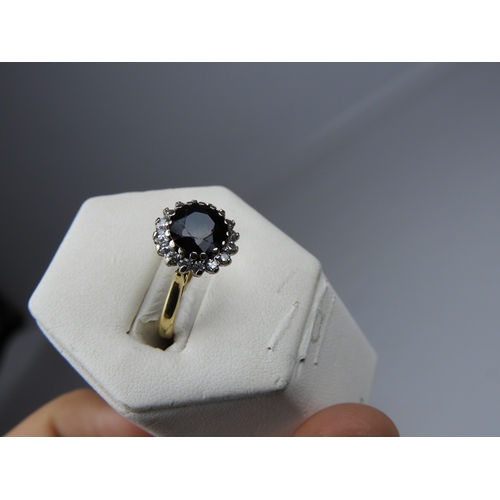 58 - 18ct Gold Diamond and Black Sapphire Ring