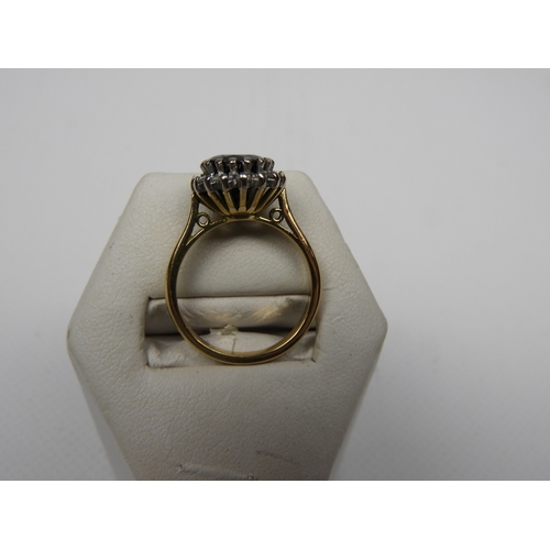 58 - 18ct Gold Diamond and Black Sapphire Ring