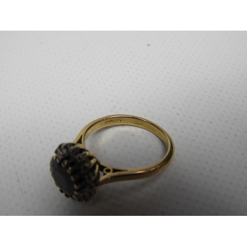 58 - 18ct Gold Diamond and Black Sapphire Ring