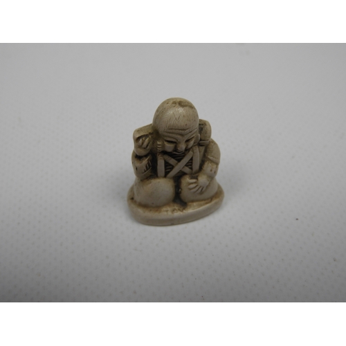 381 - Netsuke and Resin Buddha