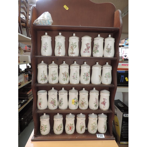 730 - Quantity of Porcelain Flower Fairy Spice Jars on Wall Rack