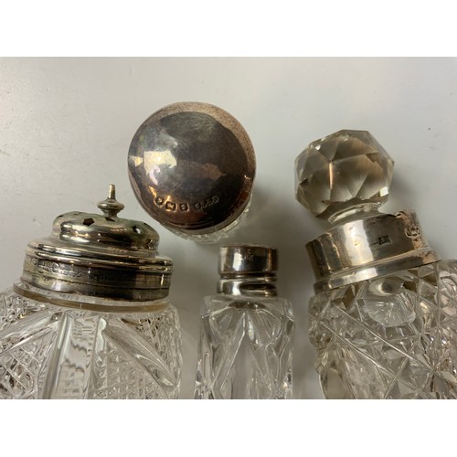 712 - 4x Silver Topped Glass Bottles