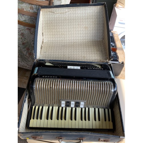 421 - Cased Hohner Accordion