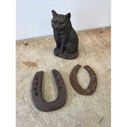 635 - Cast Iron Cat and Horse Shoes