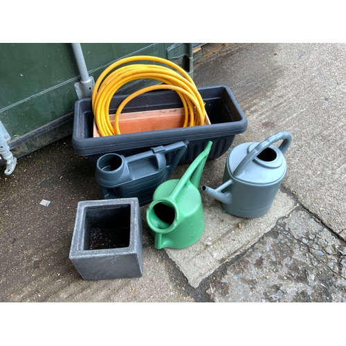 33 - Garden Hose and Watering Cans etc