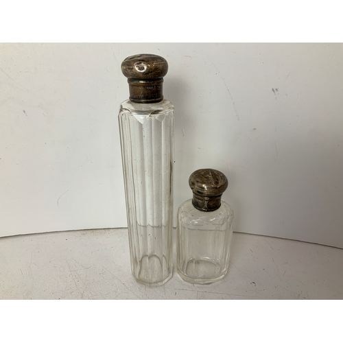 653 - 2x Silver Topped Dressing Table Bottles