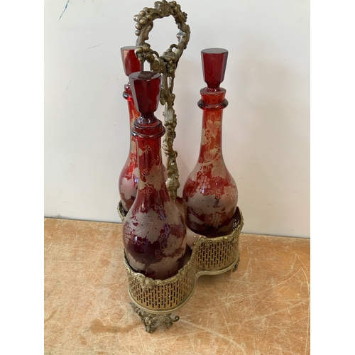 384 - Red Glass Bottles in Stand